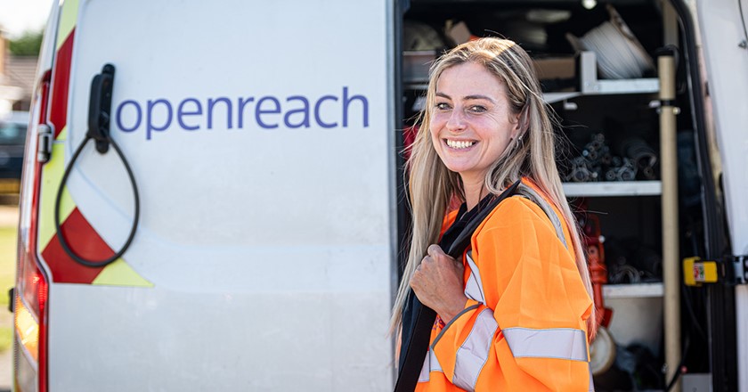 female Openreach engineer in front of Openreach van