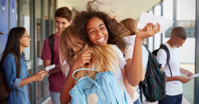 happy young people receiving exam results